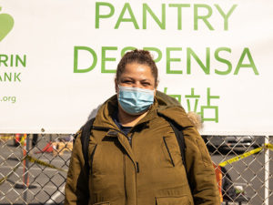 Arlesia poses in front of pop-up gate.